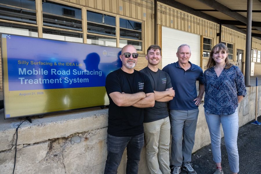 The IDEA Lab team standing with the Silly Surfacing pothole repair prototype
